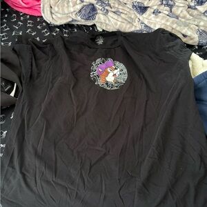 Buc-ee’s Black T-Shirt with Cartoon Character glows in the dark.